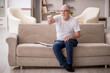 © Elnur - Old man sitting at home