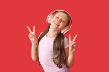 Sticker - Little girl in headphones dancing on red background