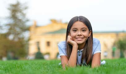 girl relax at summer lawn, advertisement. girl relax at summer lawn with grass.