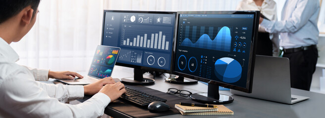 Poster - Analyst working on data analysis or BI dashboard on computer monitor. Business team analyzing financial data by Fintech in corporate office for business marketing and strategy planning. Trailblazing