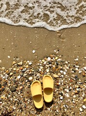 Wall Mural - yellow sandals on the beach