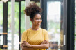 © SOMKID - Portrait of candid happy African American businesswoman.
