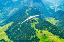 Brave Hang Glider Pilot Soar In The Mountains