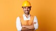 © WS Studio 1985 - Young architect man wearing builder safety helmet over isolated background happy face smiling with crossed arms.
