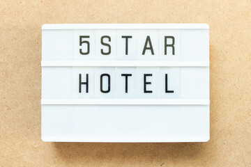 Sticker - Lightbox with word 5 star hotel on wood background