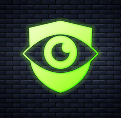 Poster - Glowing neon Shield and eye icon isolated on brick wall background. Security, safety, protection, privacy concept. Vector