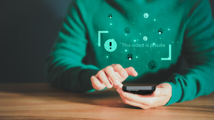 Poster - Young man using a smartphone to play social media but this video is blocked or privacy settings have been set. Searching for more internet, and search engine optimization. Subscribing and following.