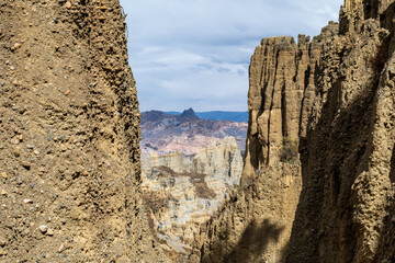 houses seen from afar between the mountains, sandstone walls and dolomites of the “valle de las anim