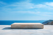 Empty marble podium on the beach with sea and blue sky background. High quality photo