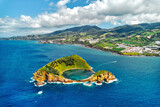 Aerial shot, drone point of view of picturesque Islet of Vila Franca do Campo. Sao Miguel island, Azores, Portugal. Heart carved by nature. Bird eye view. Travel attraction and natural wonders concept