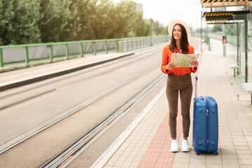 Wall Mural - Happy Passenger Lady Waiting For Tram Standing At Station Outside