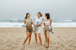 © Prostock-studio - Group of young ladies in sports clothes standing holding mats after morning workout, resting and talking