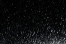 Falling Rain Drops On A Black Background. Graphic Resource For Installation Or Blank For Design. AI Generated