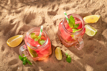 Wall Mural - Homemade lemonade with crushed ice and fruits in a jar.