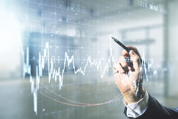 Poster - Multi exposure of trader hand with pen working with virtual abstract financial graph interface on blurred office background, financial and trading concept