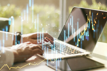 Poster - Abstract creative financial graph with hand typing on laptop on background, forex and investment concept. Multiexposure