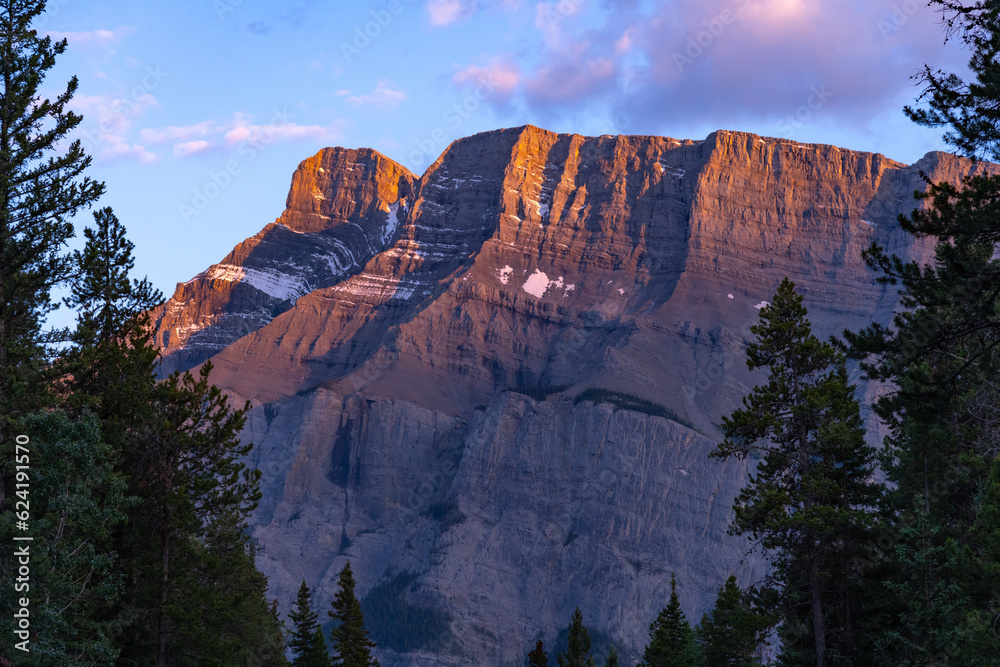Sunset sky over Mount Rundle in Banff National Park during summer time ...