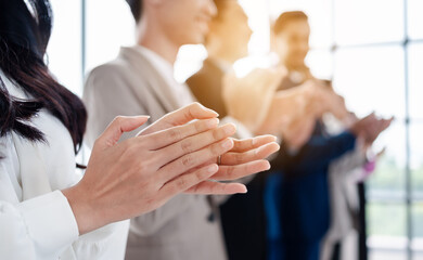 People group in meeting room conference team clapping hands for success and supporting presentation to speaker. Business meeting and seminar concept.