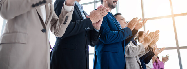 People group in meeting room conference team clapping hands for success and supporting presentation to speaker. Business meeting and seminar concept.