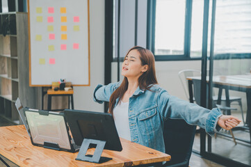 Wall Mural - Female programmers are stretching oneself and relaxing after working and planning to work on programming, software coding and web design. Concept technology development.