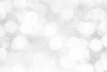Blurred Abstract Background. Abstract White And Silver Blurred Background With Glittering Lights For Display.
