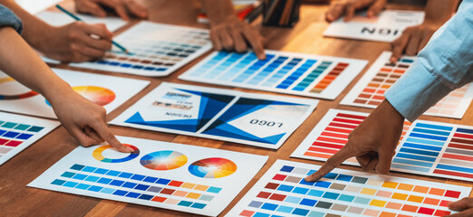 Aufkleber - Graphic designer brainstorm logo and graphic art at busy creative studio workshop. Experiment and brainstorm color palette and pattern at workspace table for creative design. Panorama shot. Scrutinize