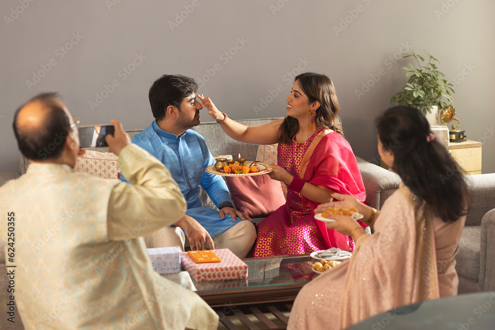 Happy Indian family celebrating Raksha Bandhan Stock Photo | Adobe Stock