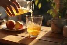 Woman Pouring Apple Juice Into Glass.