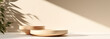 © id512 - two wooden round tray podium in sunlight, leaf shadow on beige wall background for beauty, organic, health, cosmetic product presentation