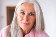 © Westend61 - Smiling mature woman with gray hair