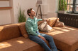 © Westend61 - Mature man with eyes closed sitting on sofa at home