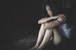 © Tinnakorn - Depressed woman sitting on ground, female in depression sadness, Physically abused woman, The concept of sexual harassment against women and rape.  human rights abuses. international women's day.