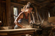 © Kalim - AI generated image of woman in wood shop