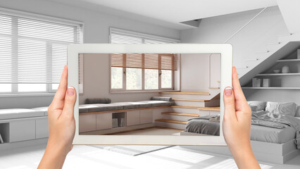 Wall Mural - augmented reality concept. hand holding tablet with ar application used to simulate furniture produc