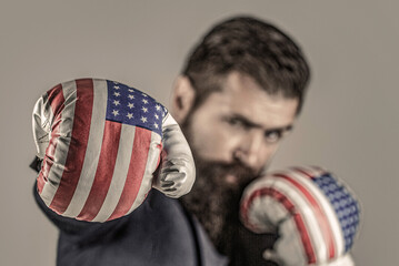 Man in suit and american boxings gloves, business winner. Boxing man USA. Businessman in Boxing gloves. Ready to business battle