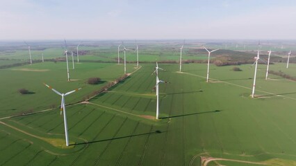 Wall Mural - Aerial flight over a wind farm in Germany. Drone move to the right