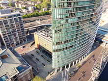 High Angle View Of Canary Wharf Buildings At Central London City Of England Great Britain. The Footage Was Captured With Drone's Camera At Low Altitude On 08-June-2023	