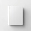 © OGGYA - Blank plain white book cover mockup. top view. White background