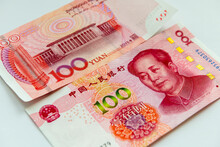 The Front And Back Of A Chinese 100 Yuan Bank Note Isolated In White.