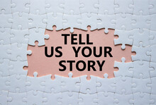 Tell Us Your Story Symbol. Concept Words Tell Us Your Story On White Puzzle. Beautiful Pink Background. Business And Tell Us Your Story Concept. Copy Space.