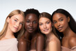 © STORYTELLER - Beauty. Group Of Diversity Models Portrait. Multi-Ethnic Women With Different Skin Types Posing On Beige Background. Tender Multicultural Girls Standing Together And Looking At Camera