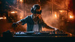 © PaulShlykov - happy dj girl with blonde hair using dj mixer in nightclub with smoke