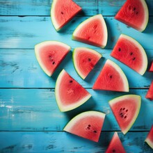 Watermelon Slice Popsicles On A Blue Wood Background. Generative AI.