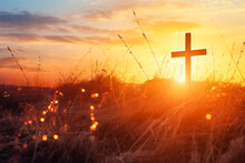 Silhouette Christian Cross On Grass In Sunrise