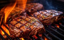 Close-up Of Grilling Steaks Of Meat On Barbecue With Open Flames. Backyard BBQ. AI Generative