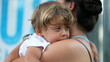 © Marco - Exhausted child falling asleep on mother arms during afternoon nap
