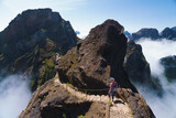 Fototapeta Krajobraz - Hiker on PR1 Pico do Arieiro - Pico Ruivo trail Stairway to Heaven Madeira Portugal