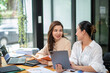 © Wasana - Two colleague businesswoman are meeting online, marketing plan, business plan, checking statistics and accounting.