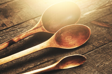 Wall Mural - Closeup of various wooden spoons on the table