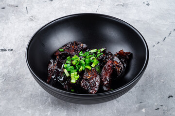 Wall Mural - Braised eggplants in soy sauce with green onions.